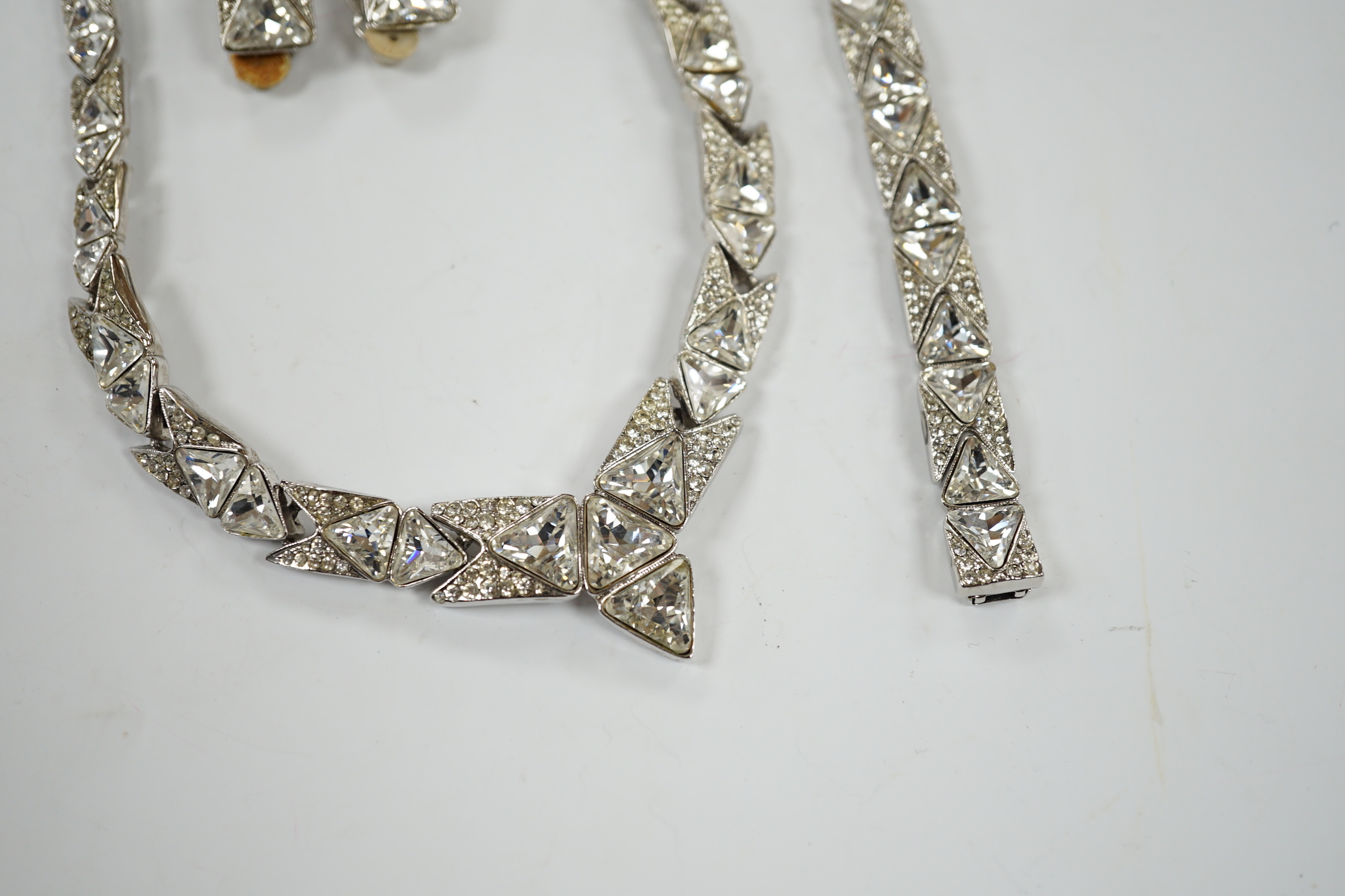 A suite of white paste set jewellery, comprising a necklace, bracelet and pair of earrings, in a Butler & Wilson box, bracelet 16.5cm.